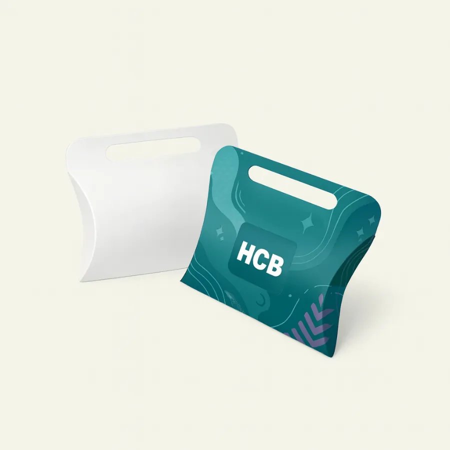 Pillow gift boxes with handles- one is white and one features a modern teal pattern- class=
